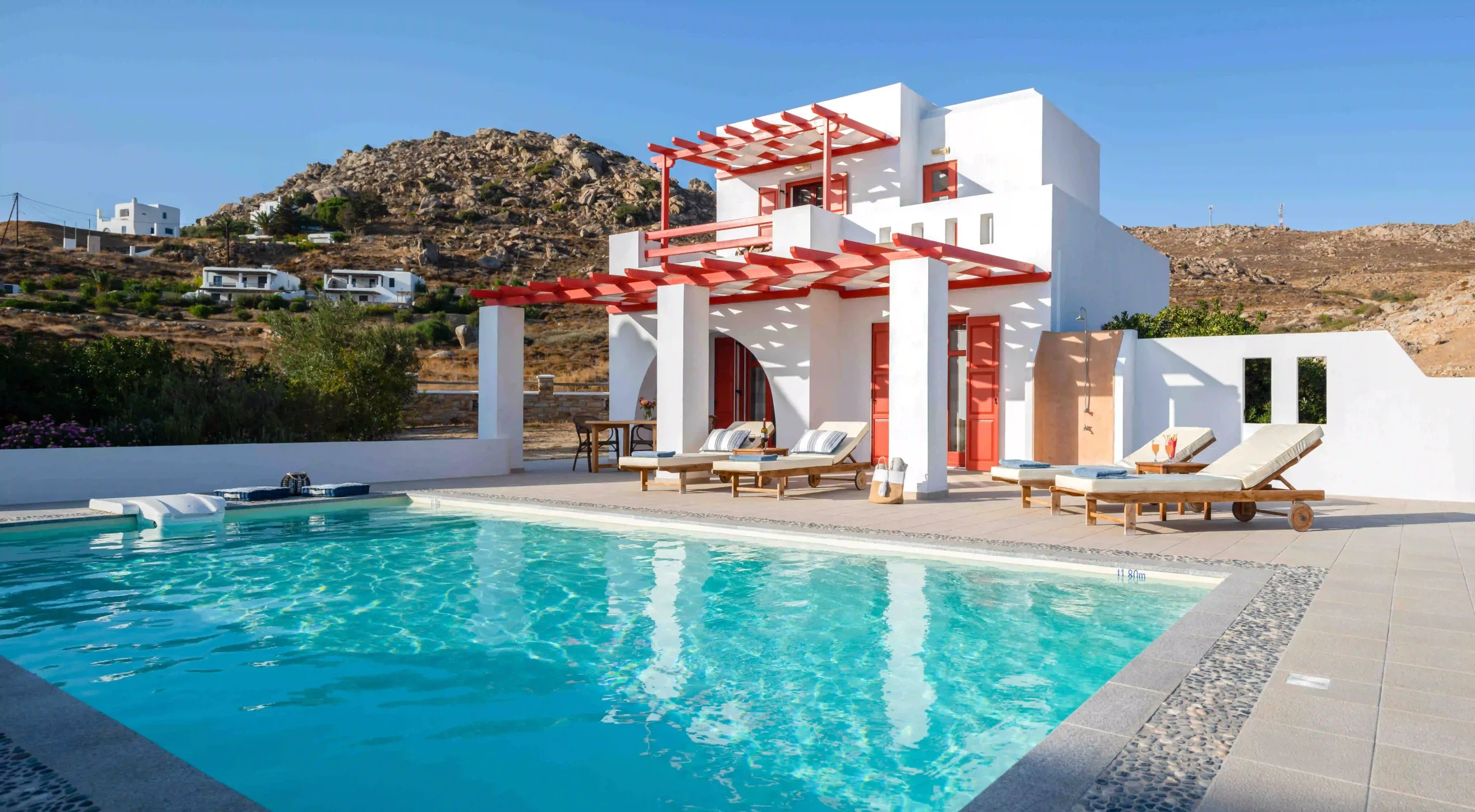 Luxury villas Dunes patio and private pool equipped with sunbeds at Natura villas in Naxos